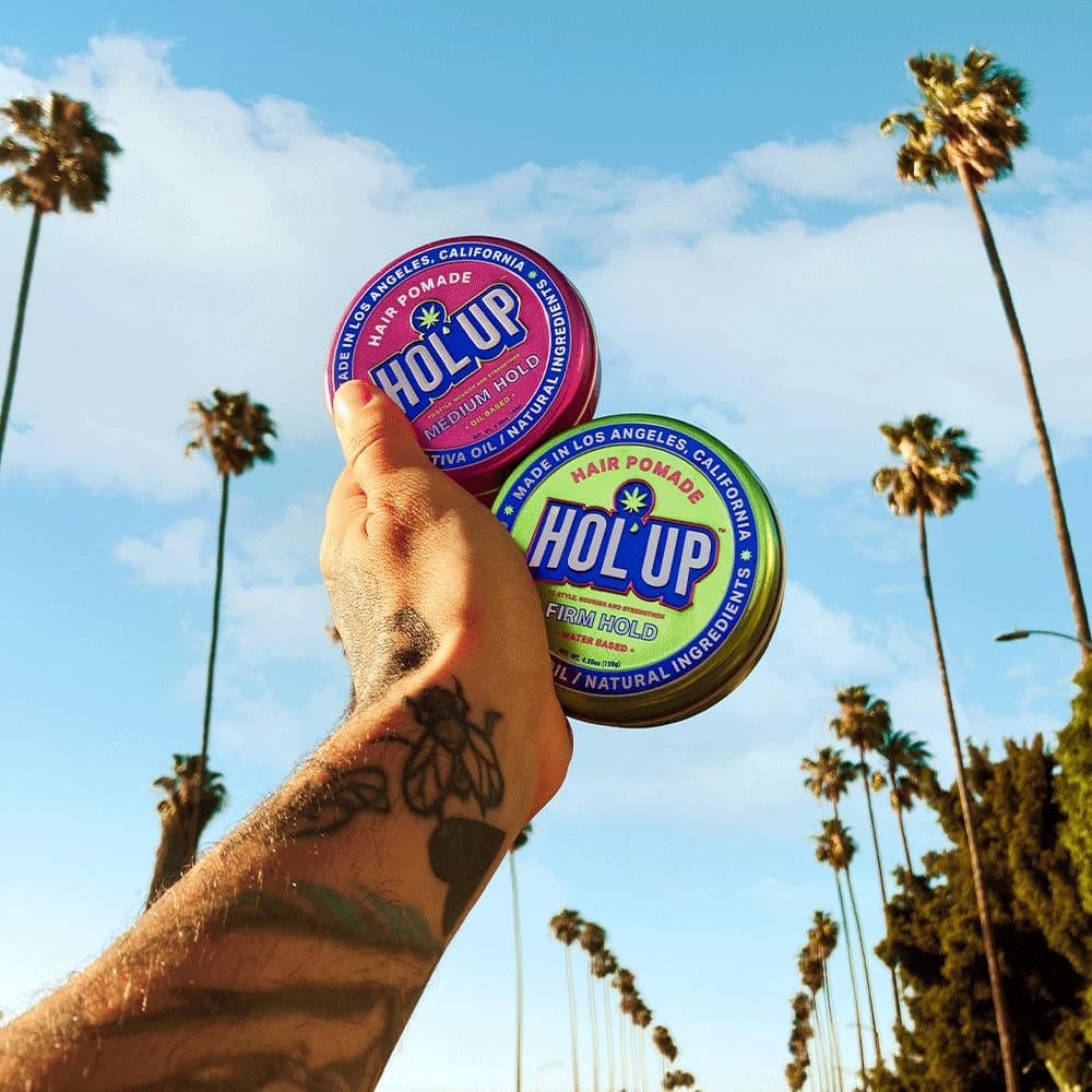 HOL'UP brand campaign, product floating against blue sky