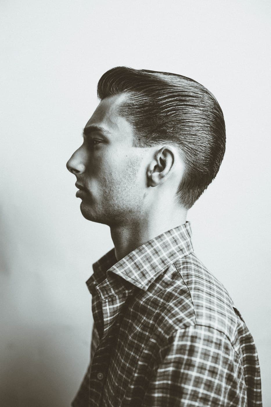 Black and white editorial portrait — side profile