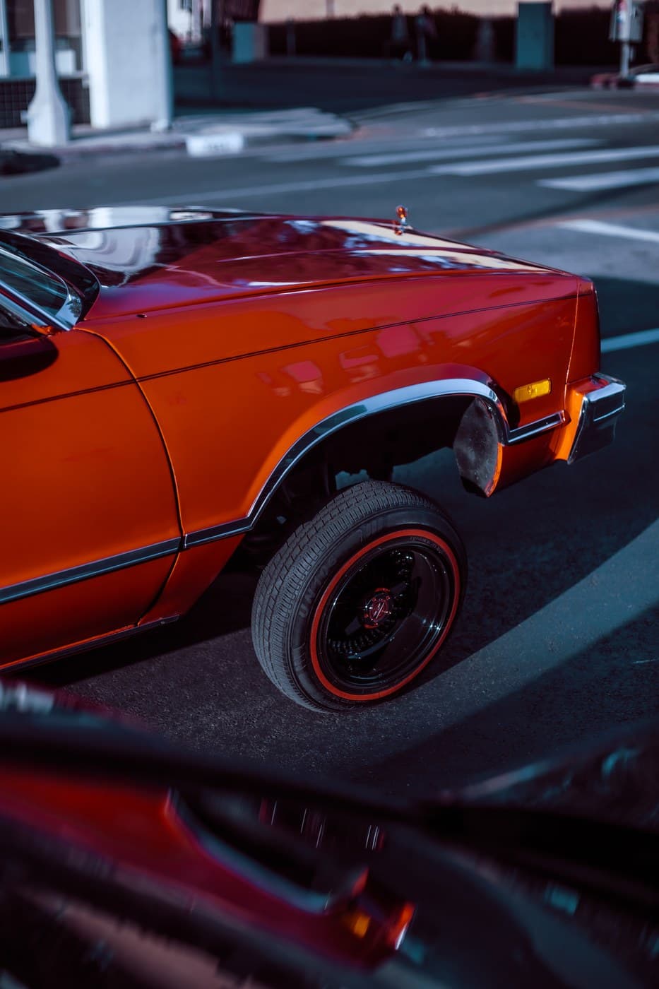 Orange classic muscle car rear quarter panel low and slammed